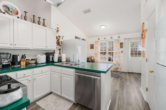 kitchen with dishwasher, sink, kitchen peninsula, light hardwood / wood-style flooring, and white cabinetry