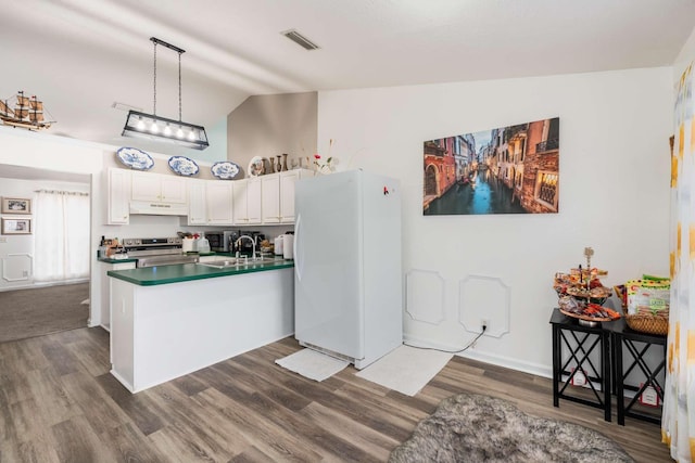 kitchen with pendant lighting, stainless steel electric range, lofted ceiling, white cabinets, and white refrigerator