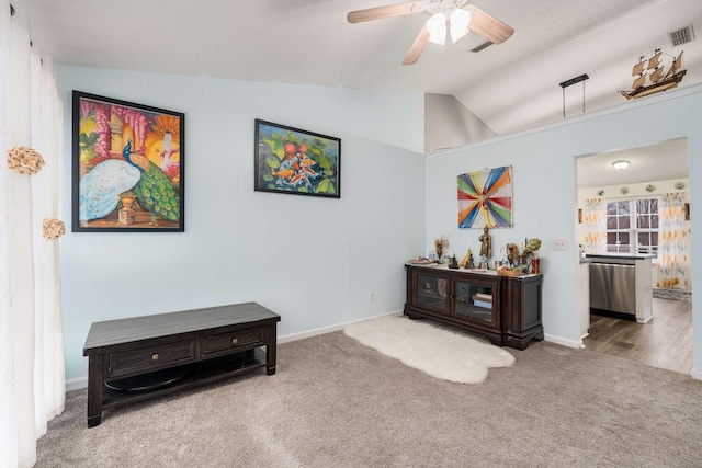 sitting room featuring carpet floors, ceiling fan, and lofted ceiling