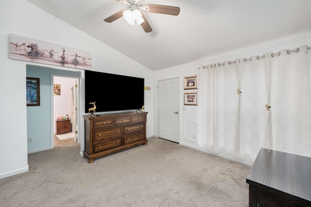 carpeted living room featuring vaulted ceiling and ceiling fan