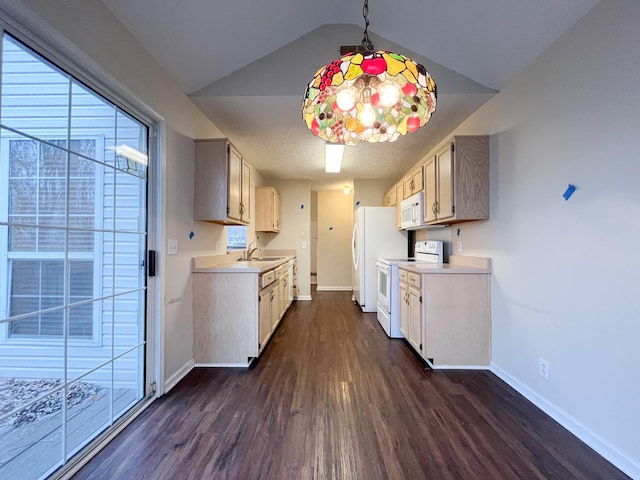 kitchen featuring vaulted ceiling, sink, dark wood-type flooring, and white appliances