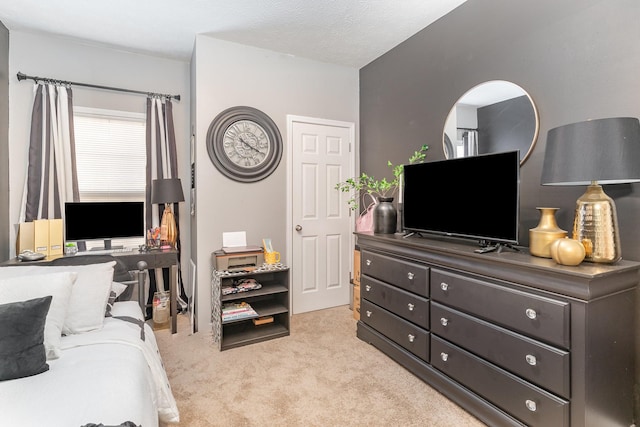 carpeted bedroom featuring a textured ceiling