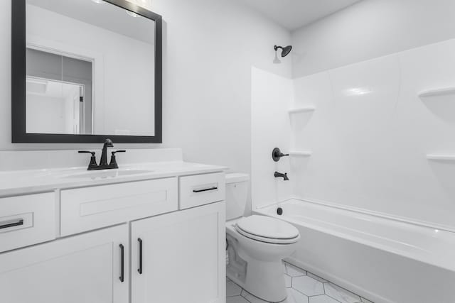 full bathroom with tile patterned flooring, vanity, shower / bathtub combination, and toilet