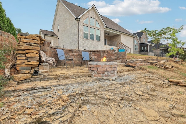 back of property featuring ceiling fan