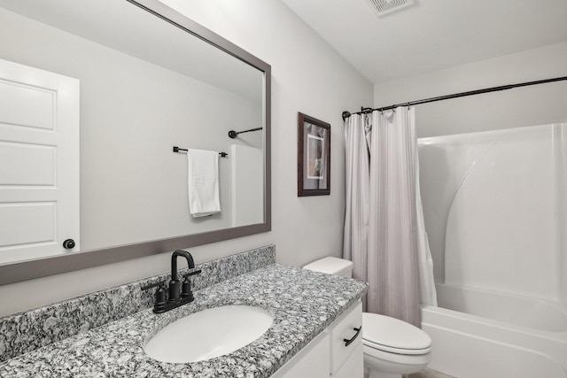 full bathroom with shower / bath combo with shower curtain, vanity, and toilet