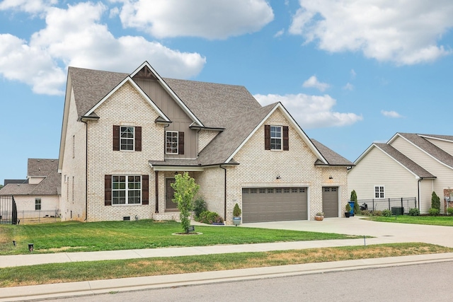 view of front of property with a front yard and a garage