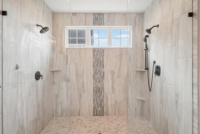 bathroom with a tile shower