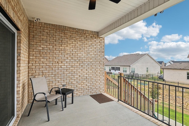 balcony featuring ceiling fan