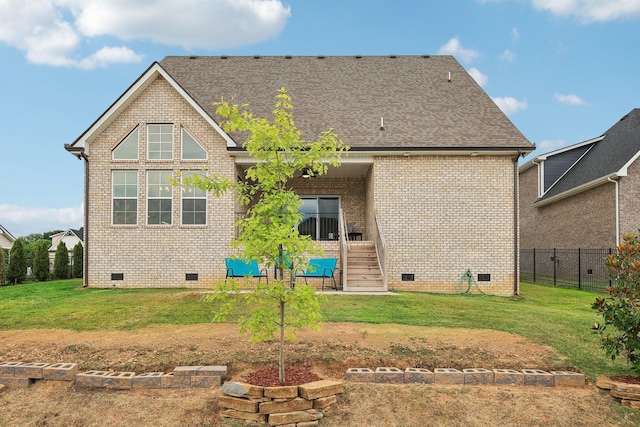 rear view of house with a lawn