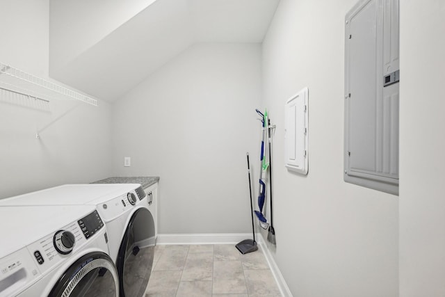 laundry room with washer and dryer, light tile patterned floors, and electric panel