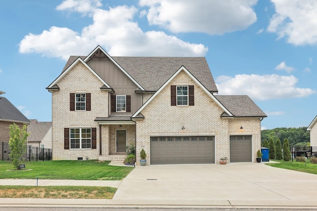 craftsman inspired home with a garage and a front lawn