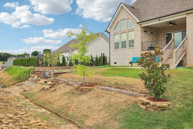 view of yard featuring ceiling fan