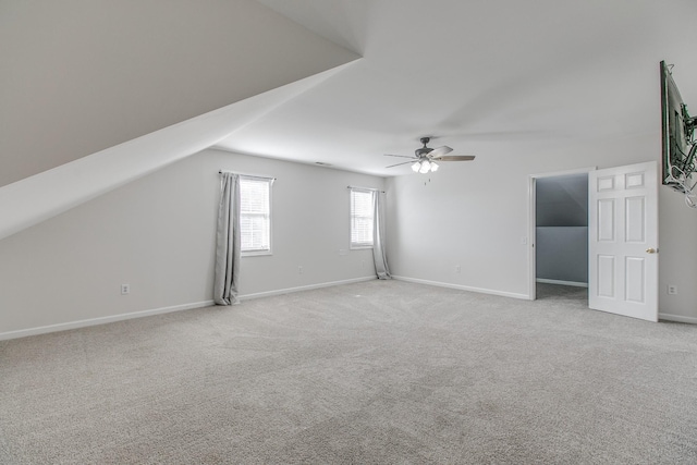 bonus room featuring light carpet, ceiling fan, and lofted ceiling