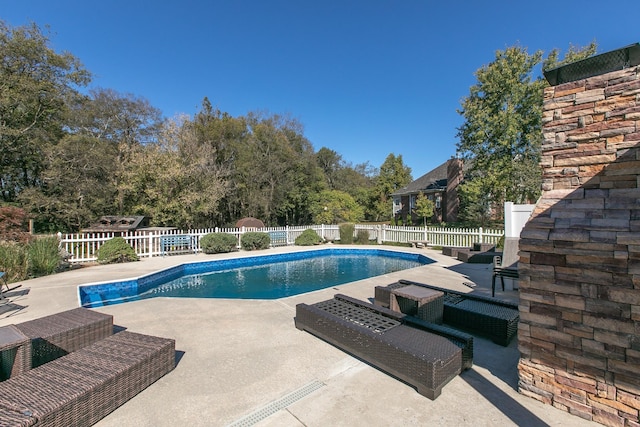 view of swimming pool featuring a patio