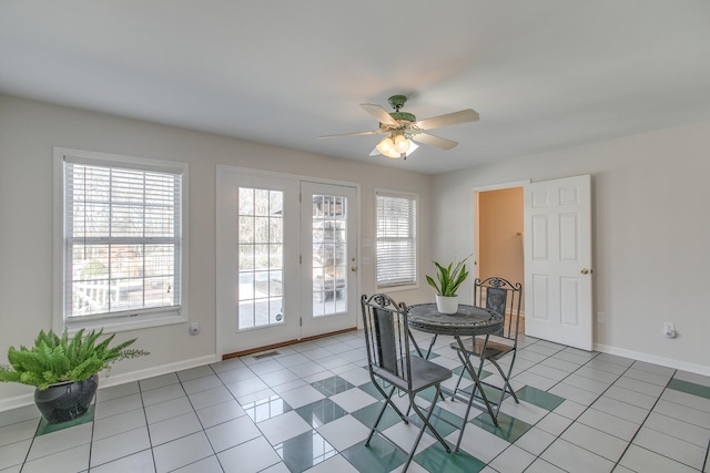 dining area with ceiling fan and light tile patterned floors