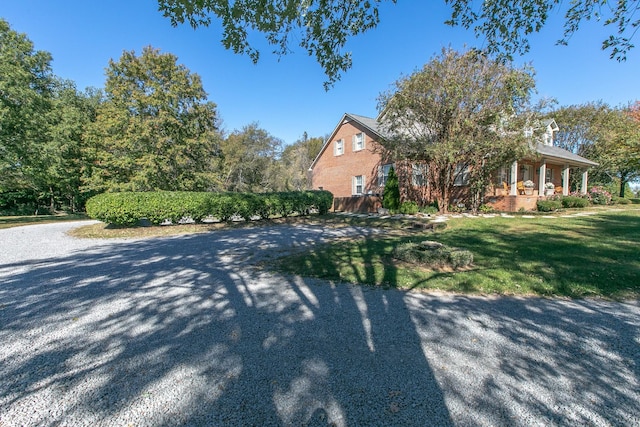 view of home's exterior with a lawn