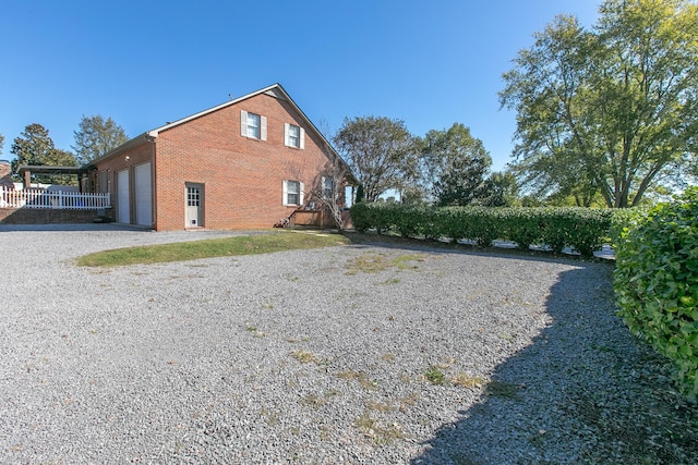 view of property exterior with a garage