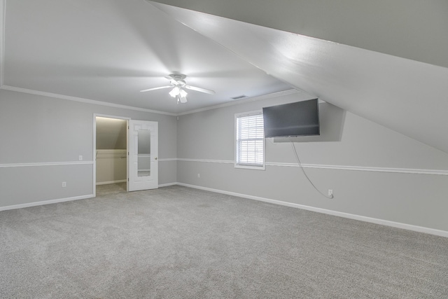 unfurnished bedroom with ceiling fan, a closet, carpet, and crown molding