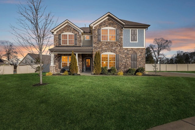 view of front of home with a lawn