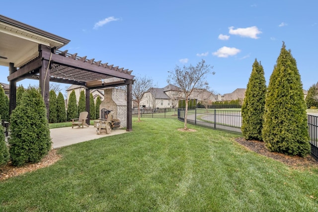 view of yard with an outdoor brick fireplace, a pergola, and a patio