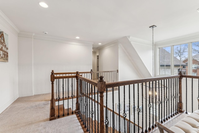 corridor with light colored carpet and ornamental molding