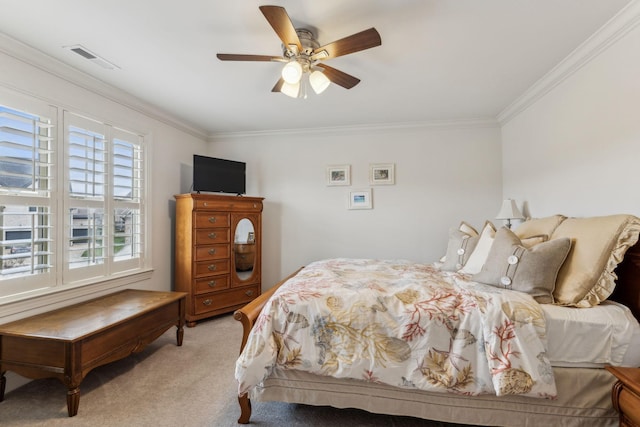 bedroom with light colored carpet, ceiling fan, and crown molding