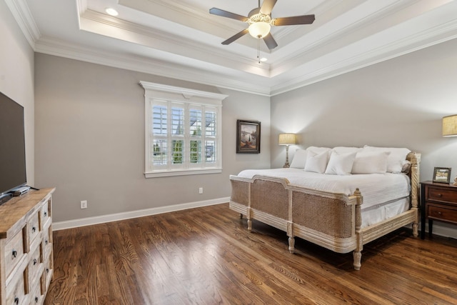 bedroom featuring a raised ceiling, ceiling fan, crown molding, and dark wood-type flooring