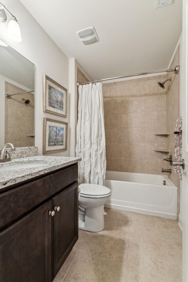 full bathroom with vanity, shower / bath combo, and toilet