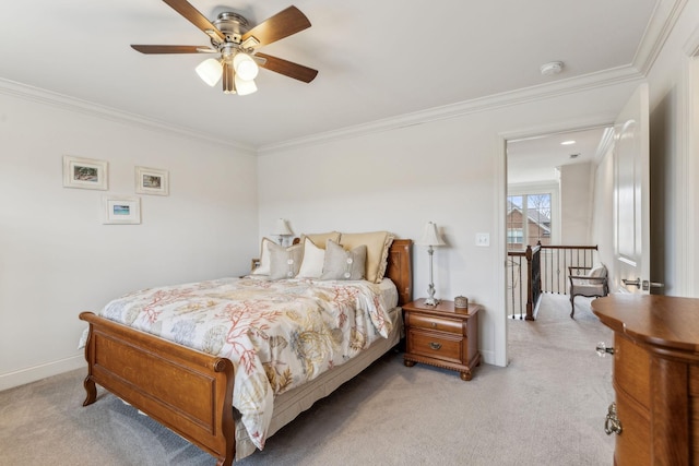 carpeted bedroom with ceiling fan and crown molding