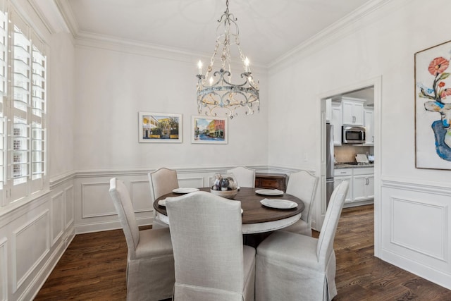 dining room with crown molding, dark wood-type flooring, and an inviting chandelier