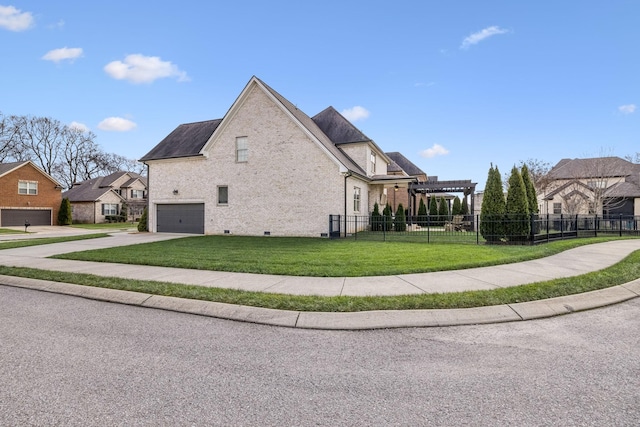 view of side of home with a garage and a yard