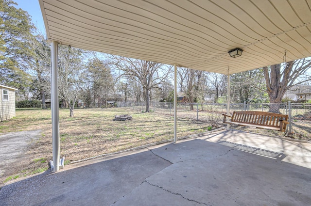 view of patio / terrace with an outdoor fire pit and fence