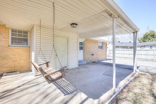 view of patio / terrace featuring fence