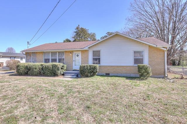 single story home featuring brick siding, fence, a front lawn, and roof with shingles