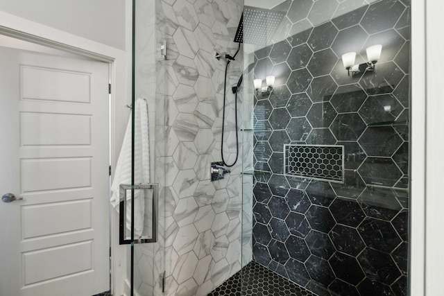 bathroom featuring a shower with shower door