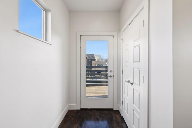 doorway with dark hardwood / wood-style flooring