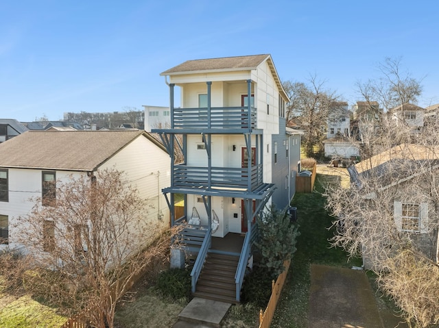 view of front of house featuring a balcony