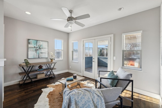 living room featuring ceiling fan, dark wood-type flooring, and french doors