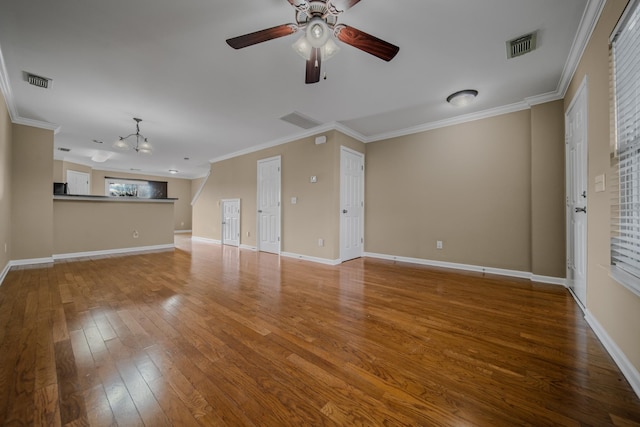 unfurnished living room with hardwood / wood-style floors, ceiling fan with notable chandelier, and ornamental molding