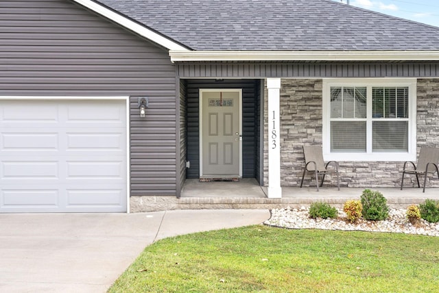 property entrance with covered porch and a garage