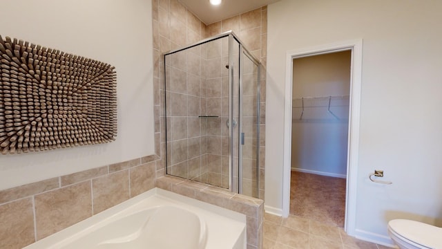 bathroom with toilet, independent shower and bath, and tile patterned flooring