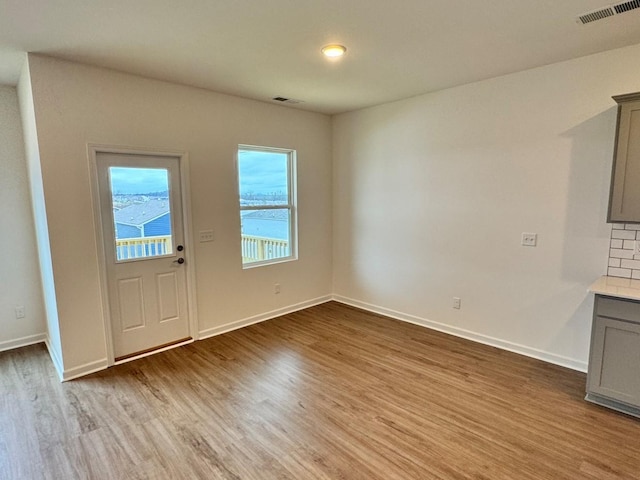 foyer with light wood-type flooring