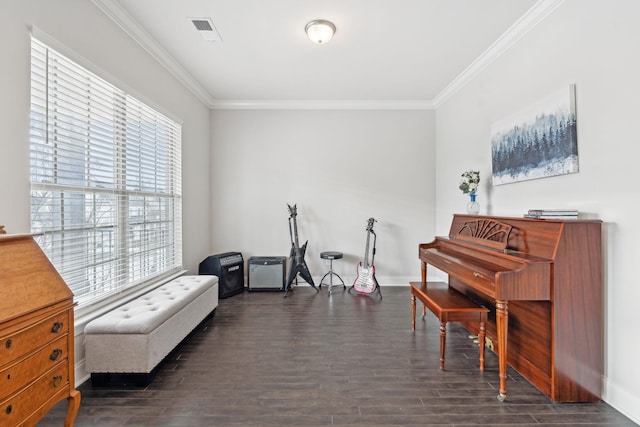 living area with dark hardwood / wood-style flooring and ornamental molding