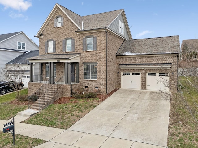 view of front of property featuring a porch and a garage