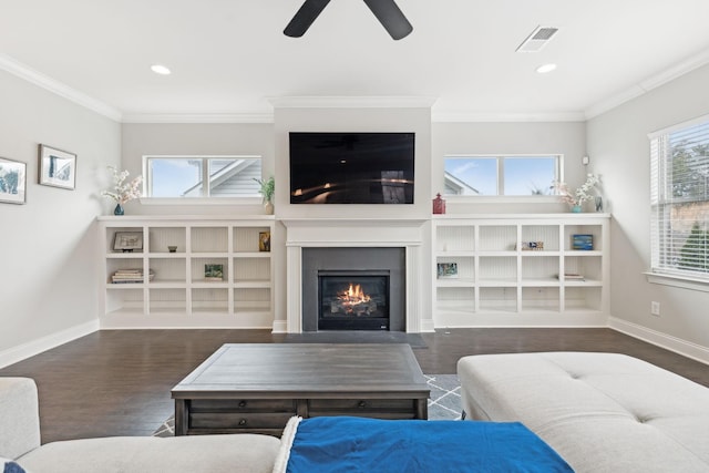 living room with ceiling fan, dark hardwood / wood-style flooring, and crown molding