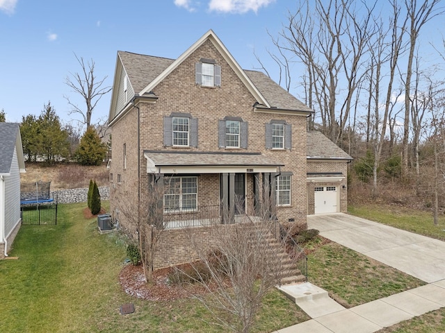 view of property with a front lawn, covered porch, and a trampoline