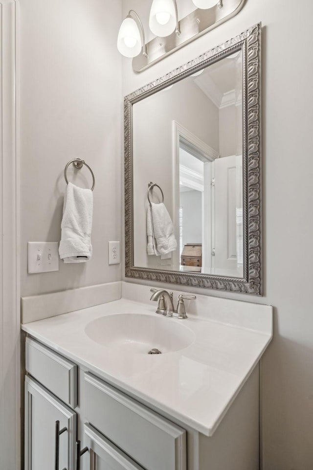 bathroom featuring vanity and crown molding