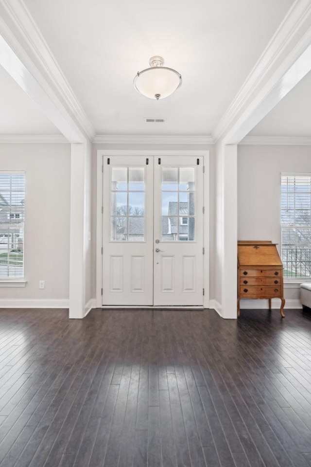 entryway featuring french doors, dark hardwood / wood-style flooring, and ornamental molding