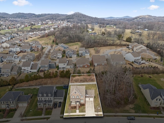 drone / aerial view featuring a mountain view