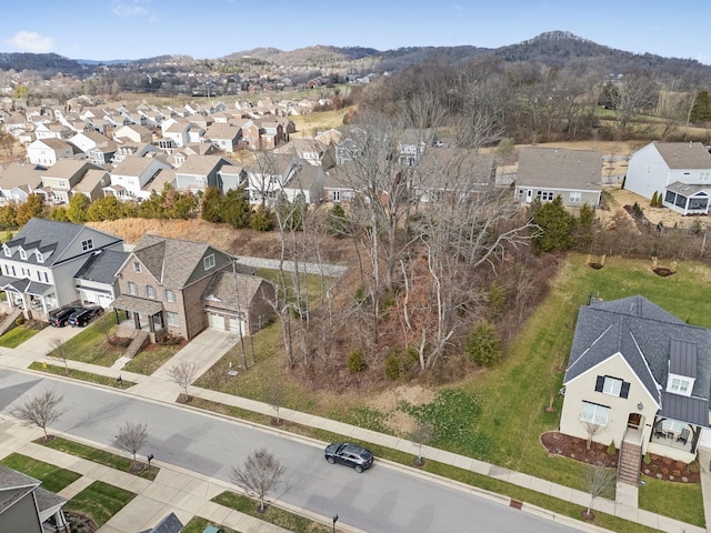 birds eye view of property featuring a mountain view